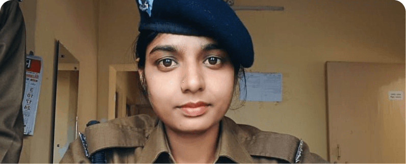 Close-up portrait of a young woman in blue beret